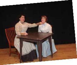 Sharon True as Mrs. Webb consoles her on-stage daughter, Emily Webb, played by Brigid Wallace.