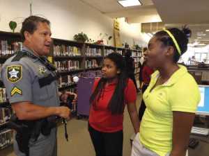 Youth Relations Cpl. Rick Roman chats with students in the library at Golden Gate Middle School. The Sheriff’s Office has been providing deputies in Collier County schools since 1977. Photo by Cpl. Efrain Hernandez/CCSO