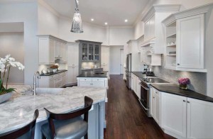 THIS THREE PALMS REMODEL COMPLETELY OPENED THE KITCHEN TO THE LIVING SPACE AND CREATED A WARM & INVITING GOURMET KITCHEN WITH HIGH-END APPLIANCES, HONED & LEATHERED STONE, EXQUISITE CABINETRY AND RICH MAHOGANY FLOORING.