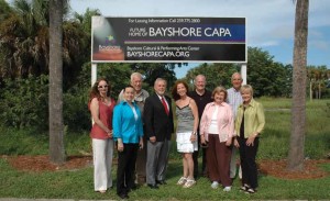 Planned site for Bayshore Cultural and Performing Arts Center. Left to right: Jean Jordan, Aurora Wells, Dwight Richardson, Commissioner Fred Coyle, Susan Gibbons, Chick Heithaus, Commissioner Donna Fiala, Steve Kutler, Sondra Quinn