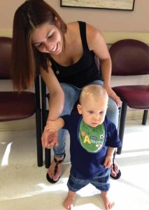 Megan Murphy and her son James share a light moment in the waiting room at Healthcare Network of Southwest Florida Children’s Care Central clinic.