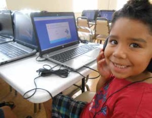 Abraham Arrendondo in the Super Kids Club learning lab where student’s work on individualized learning modules to improve their reading skills.