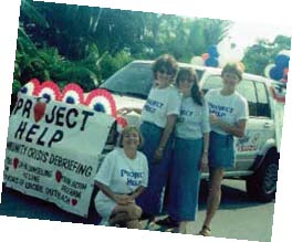 PROJECT HELP FOUNDER BETH KNAKE (THIRD FROM LEFT) AND VOLUNTEERS PARTICIPATED IN THE 1997 FOURTH OF JULY PARADE TO RAISE AWARENESS ABOUT THE ORGANIZATION.